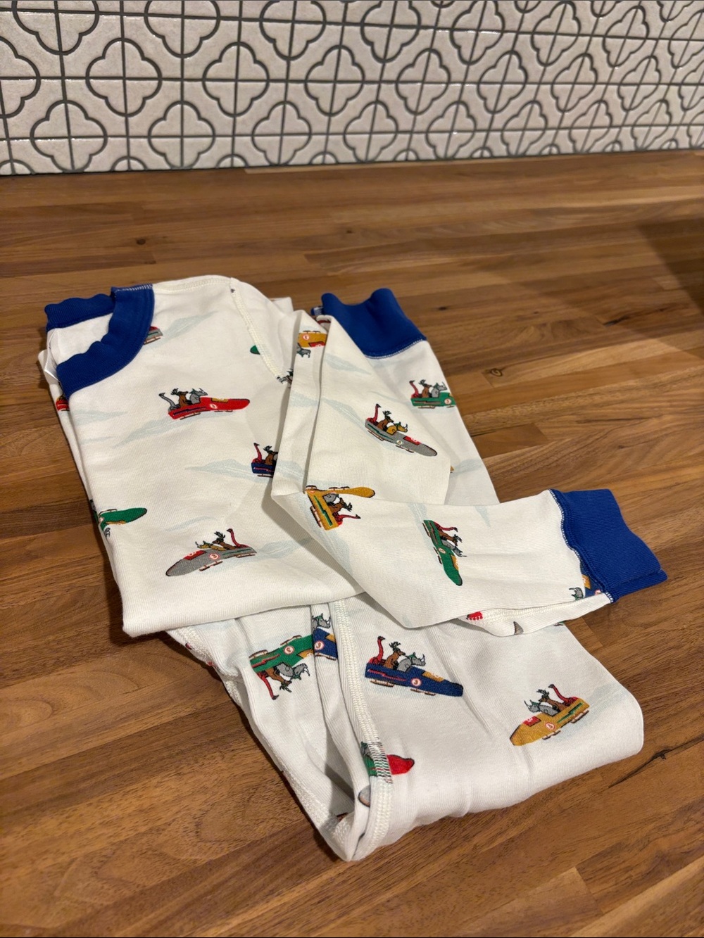 Hanna Andersson White Kids Pajama Set with Blue Trim and Multi Vehicle Print